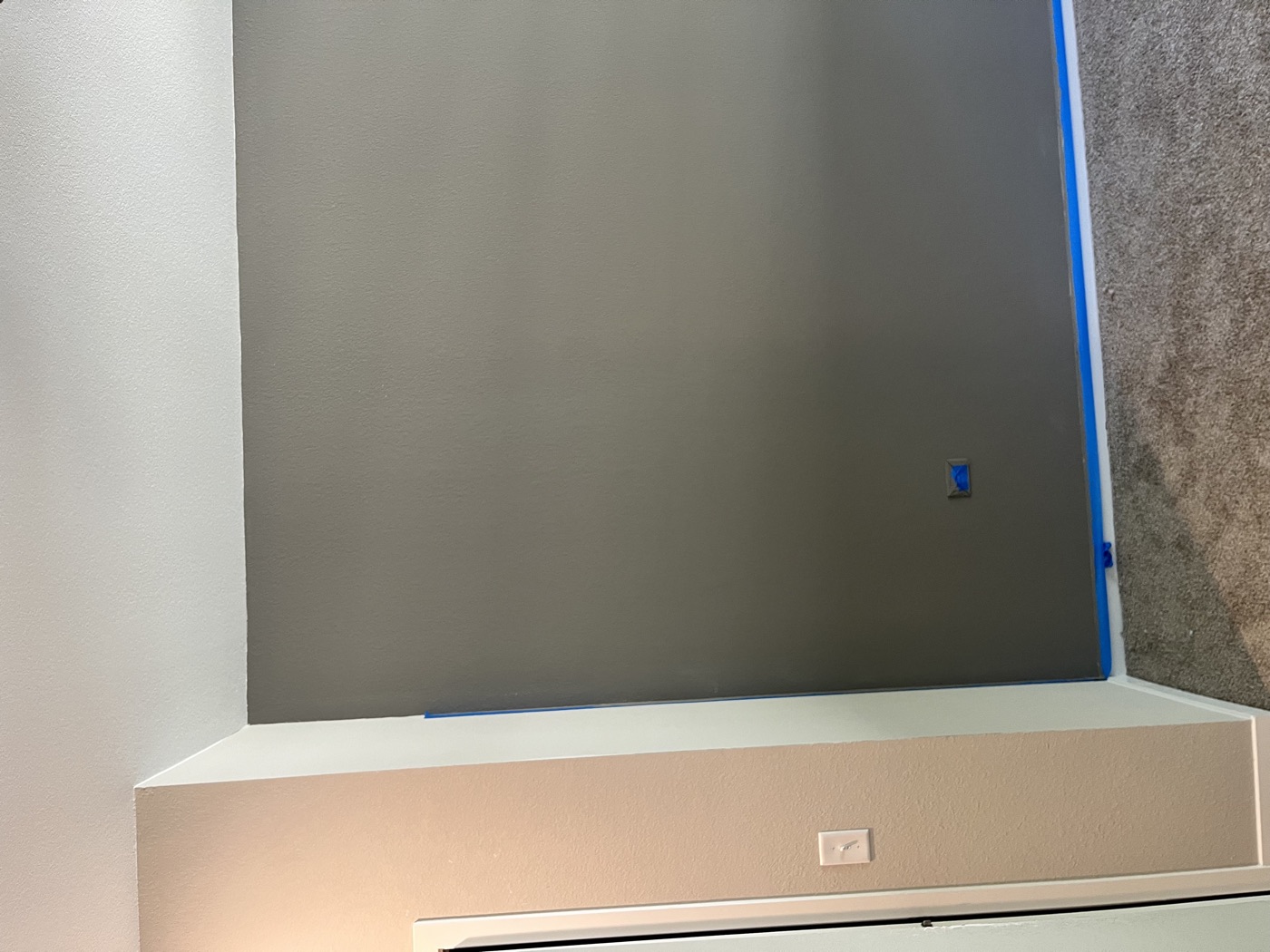 Freshly painted dark accent wall, full view