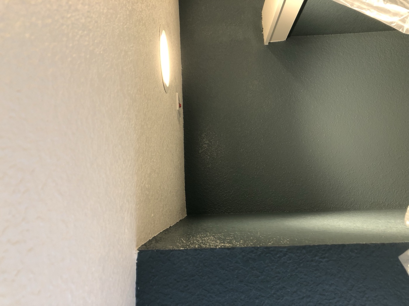 Finished two-tone accent wall corner, navy and sage green